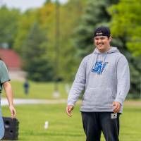 Two participants smile during a game